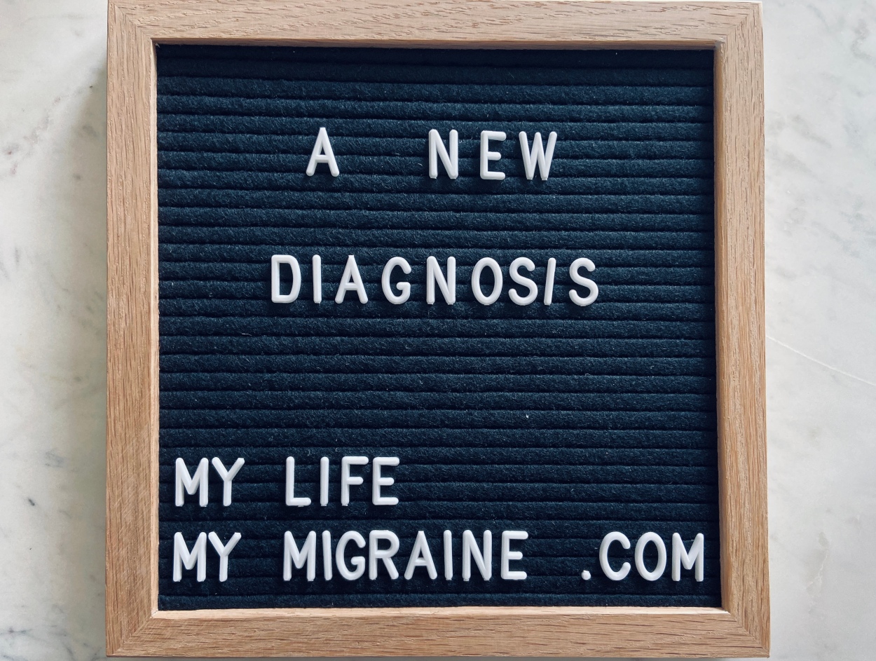 Black felt board spelling out "a new diagnosis"